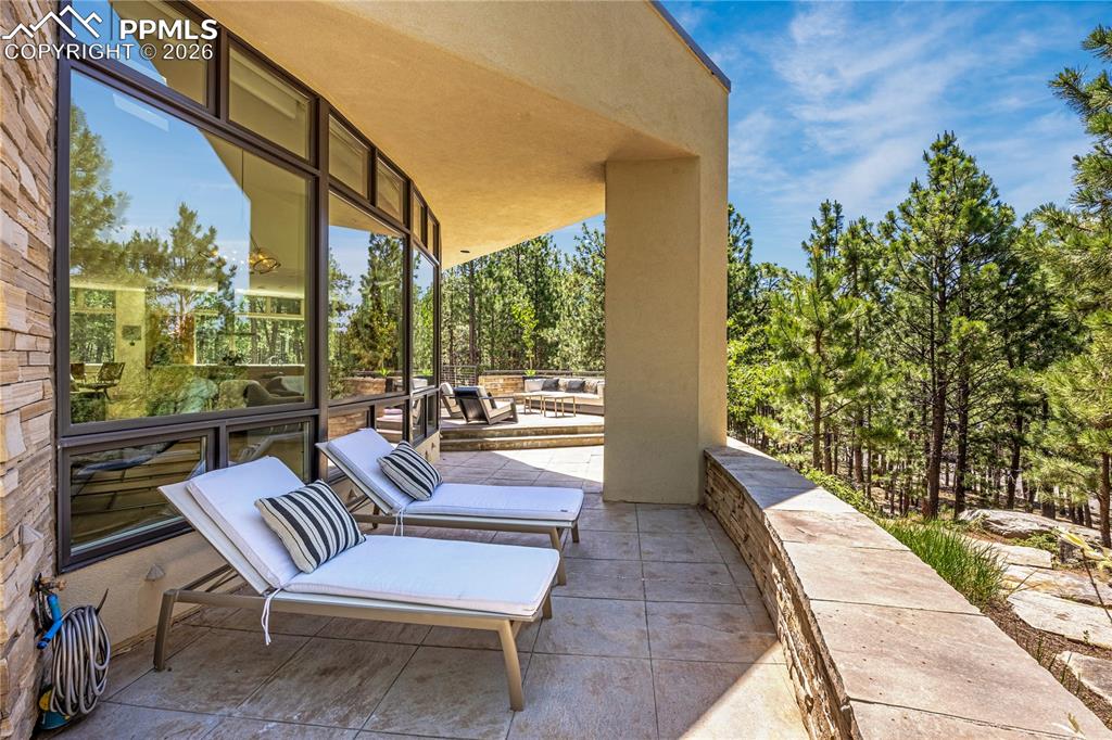 Image 11 of 48: Tomahawk overhang covering patio