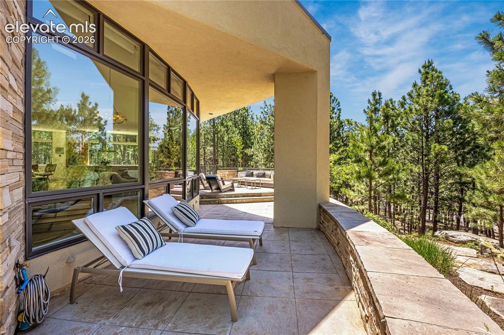 Image 12 of 49: Tomahawk overhang covering patio