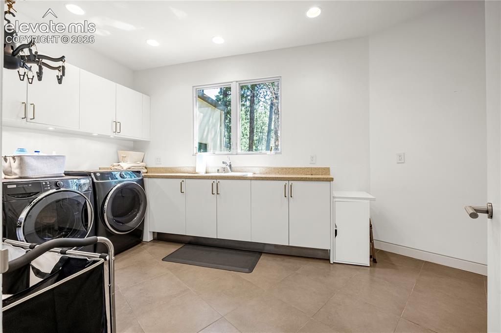 Image 23 of 49: Laundry room adjacent to garage