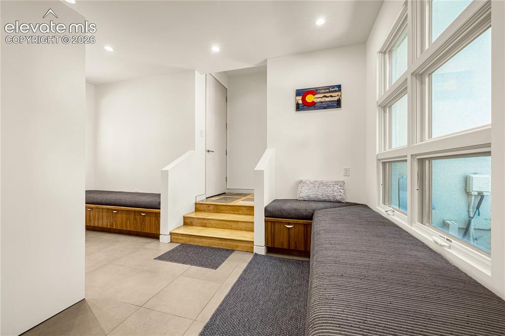 Image 25 of 49: Ample seating & storage space in mudroom