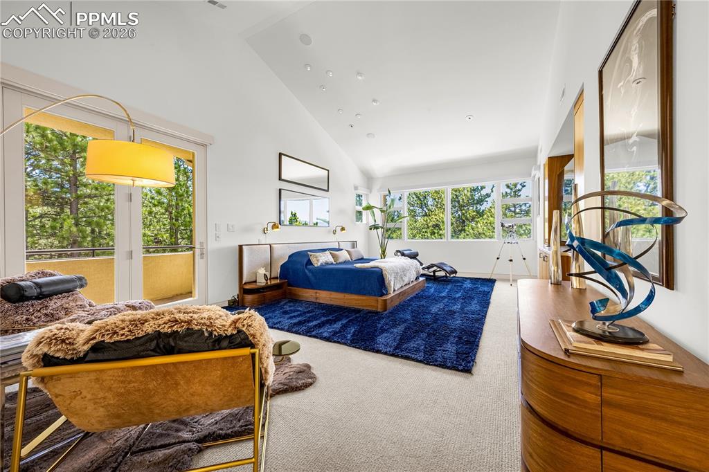 Image 26 of 48: Primary suite w/ private walk-out balcony