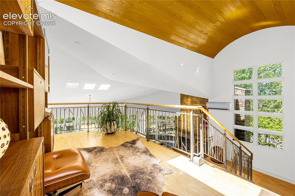 Image 26 of 49: Upper level landing leading to primary suite
