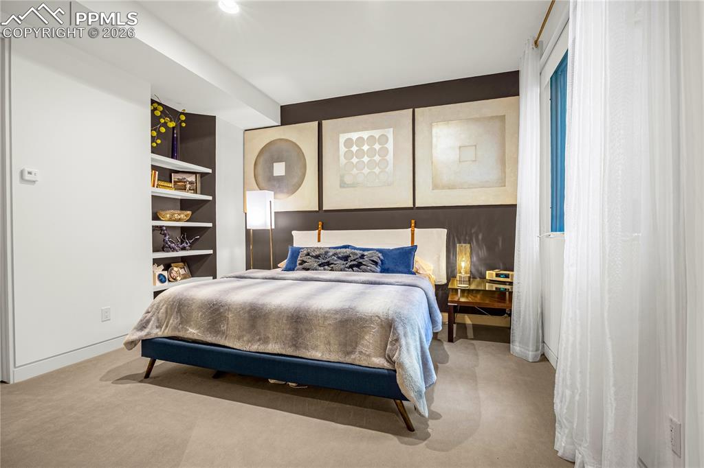 Image 37 of 48: Bedroom 2 with access to shared bathroom