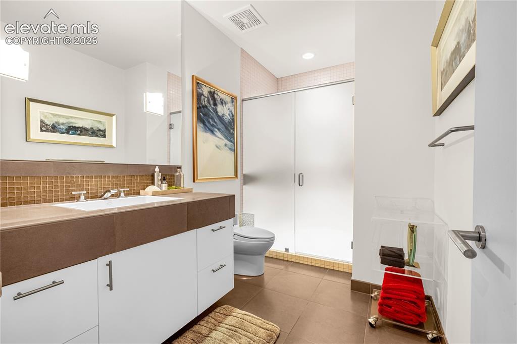 Image 40 of 49: Lower level guest bath