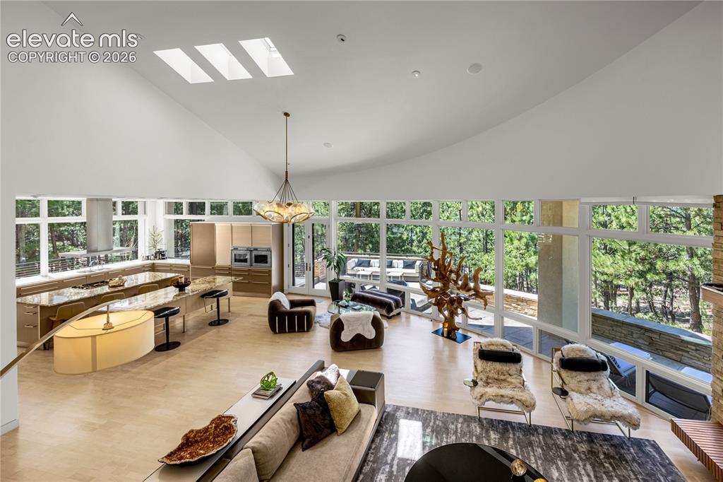 Image 8 of 49: Stunning open floorplan with cathedral ceilings