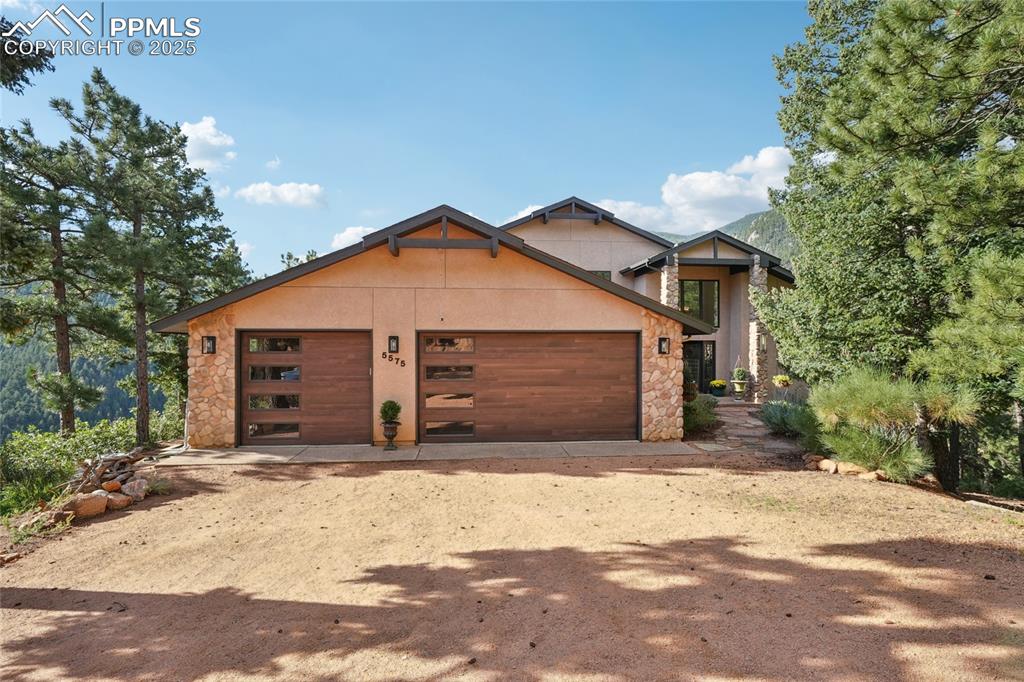 Caption: Front of this spectacular mountain home with 360 views
