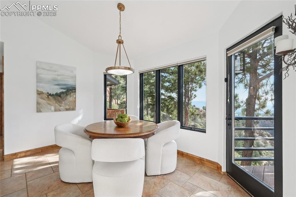Image 15 of 50: Breakfast area off kitchen with walk out to back deck