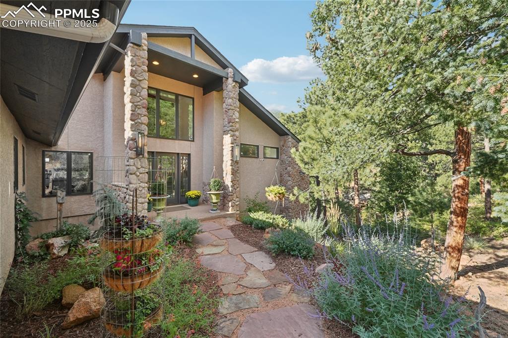 Image 2 of 50: Landscaped walkway to front entrance
