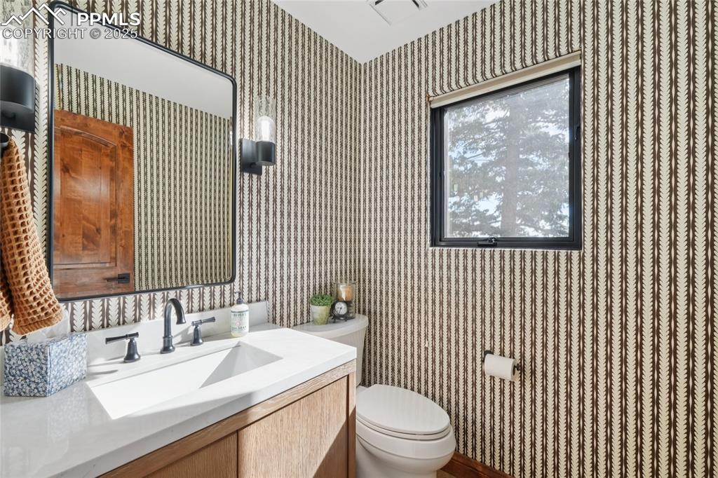 Image 21 of 50: Half bathroom on the main level