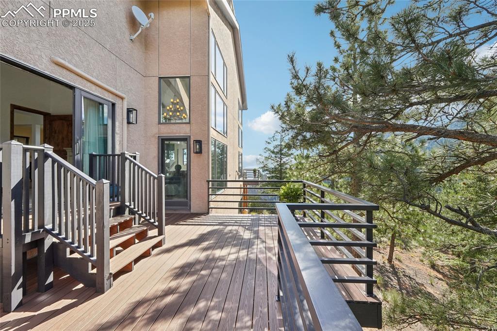 Image 24 of 50: Private deck off Primary bedroom with access from living room