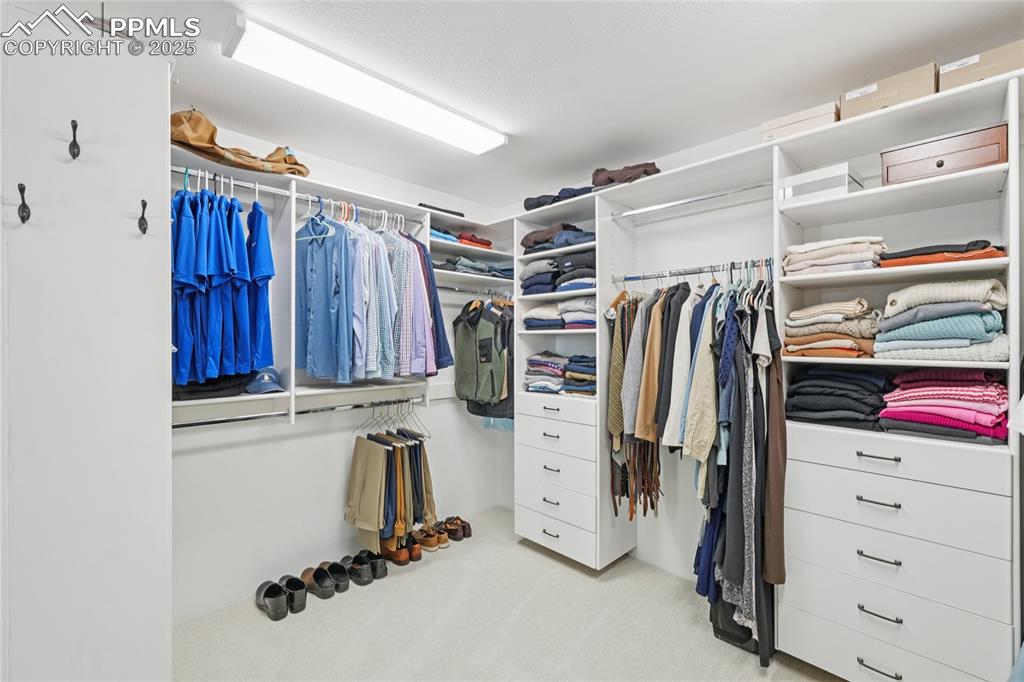 Image 28 of 50: Walk in closet in primary bathroom