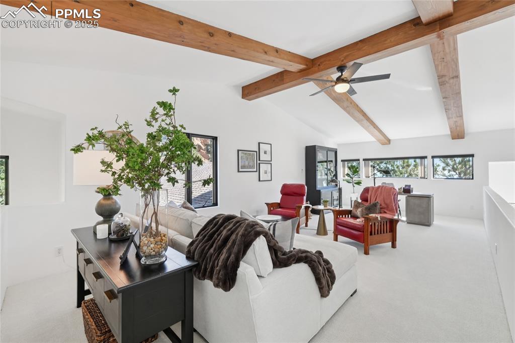 Image 29 of 50: Loft with beamed ceilings, perfect for an office