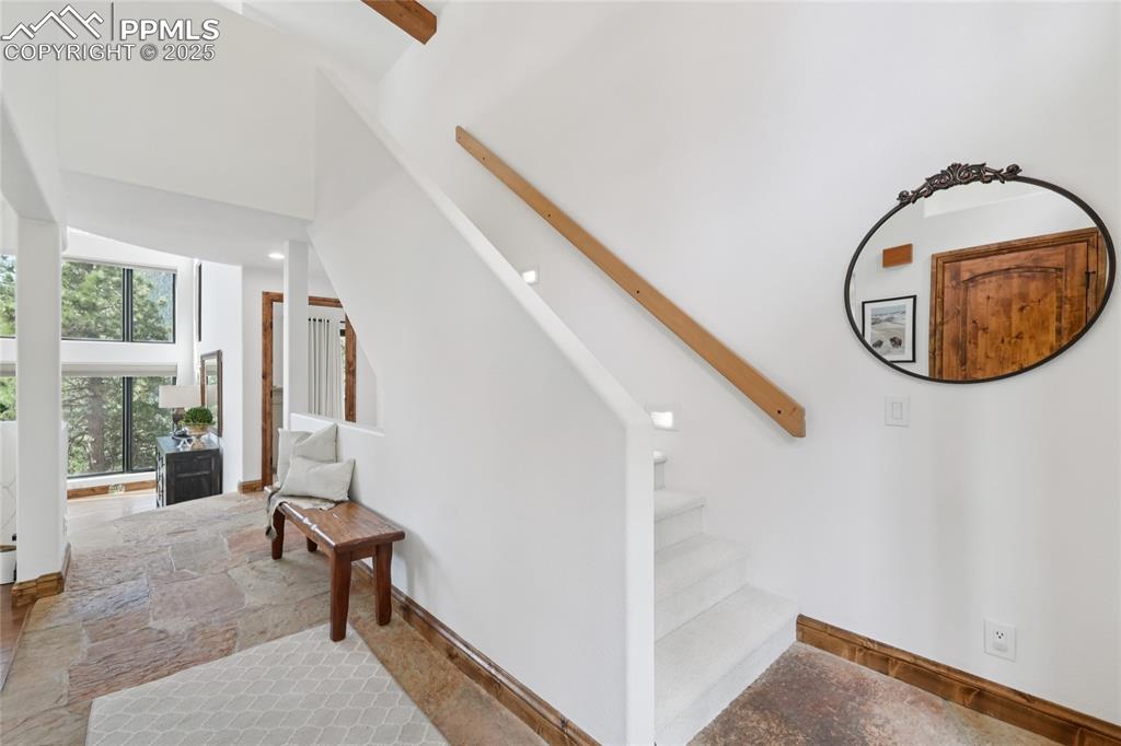 Image 3 of 50: Foyer with flagstone flooring