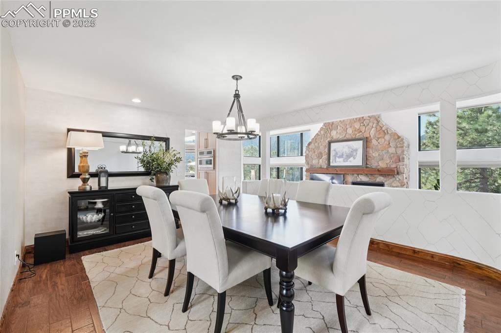 Image 4 of 50: Formal dining room with oak flooring