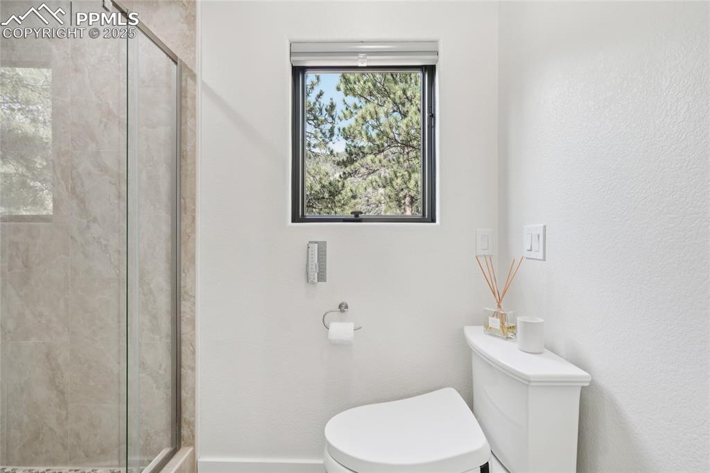 Image 42 of 50: 3/4 jack and Jill bathroom off bedroom 2 and 3