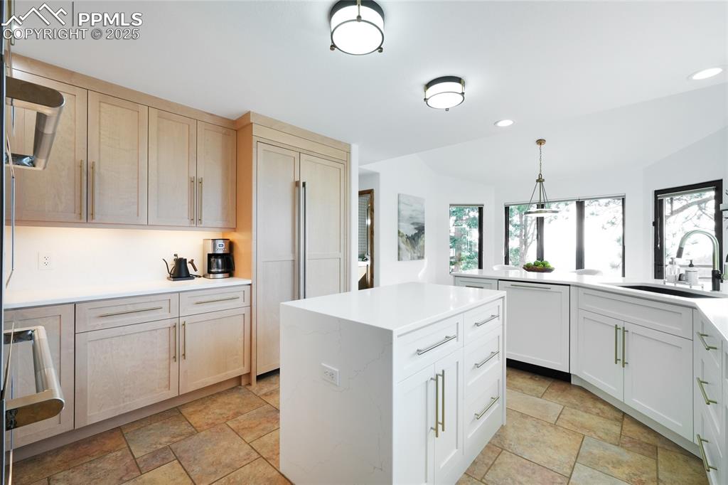 Image 5 of 50: Kitchen with tile flooring, all newly updated appliances, sink and light fi