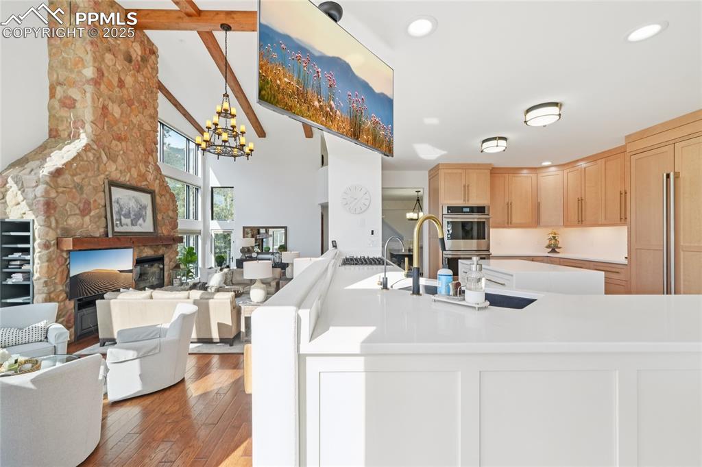 Image 7 of 50: View of the updated kitchen and living room from breakfast area
