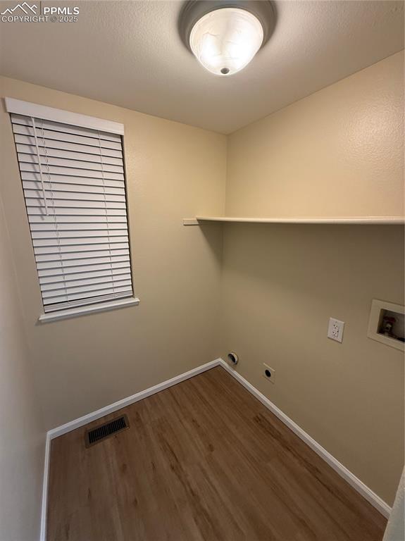 Image 11 of 31: Laundry Area In Half Bath