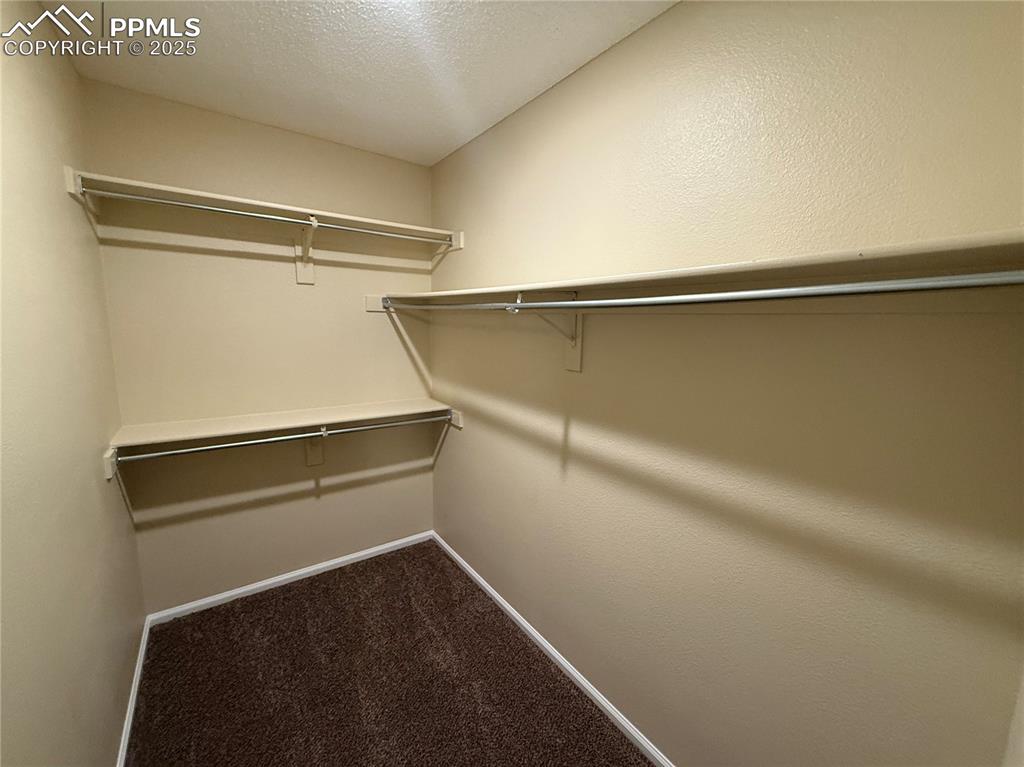 Image 17 of 31: Master Bedroom Walk In Closet 1