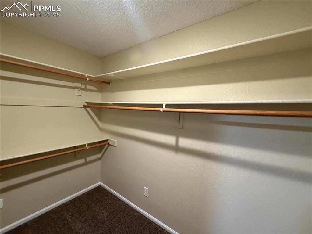 Image 20 of 31: Master Bedroom Walk In Closet 2