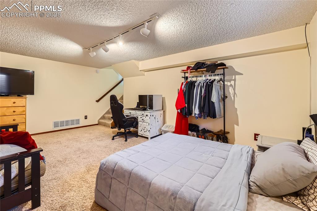 Image 20 of 26: Bedroom