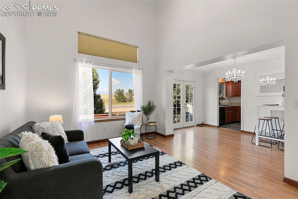Image 11 of 29: Family Room featuring bright natural lighting and open layout to dining are