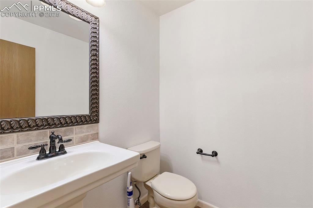 Image 14 of 29: Main floor half bathroom