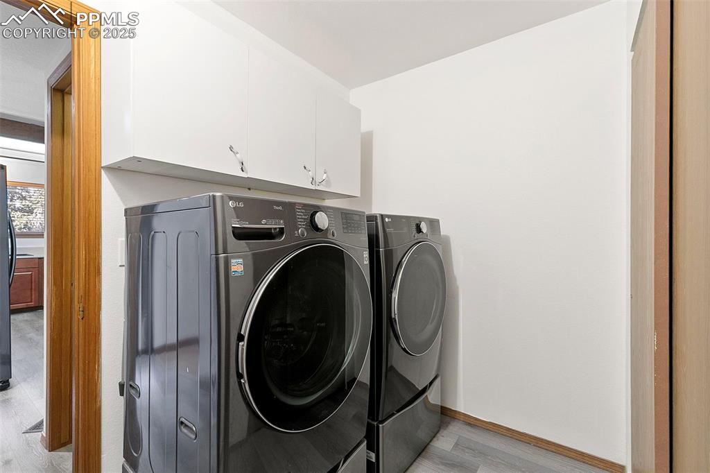 Image 15 of 29: Main floor laundry with washer and dryer included