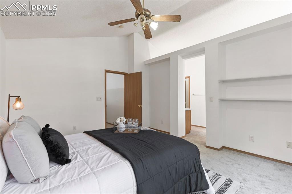 Image 17 of 29: Primary bedroom with view to en suite primary bathroom