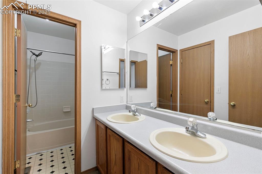 Image 24 of 29: Bathroom upstairs with access to two bedrooms