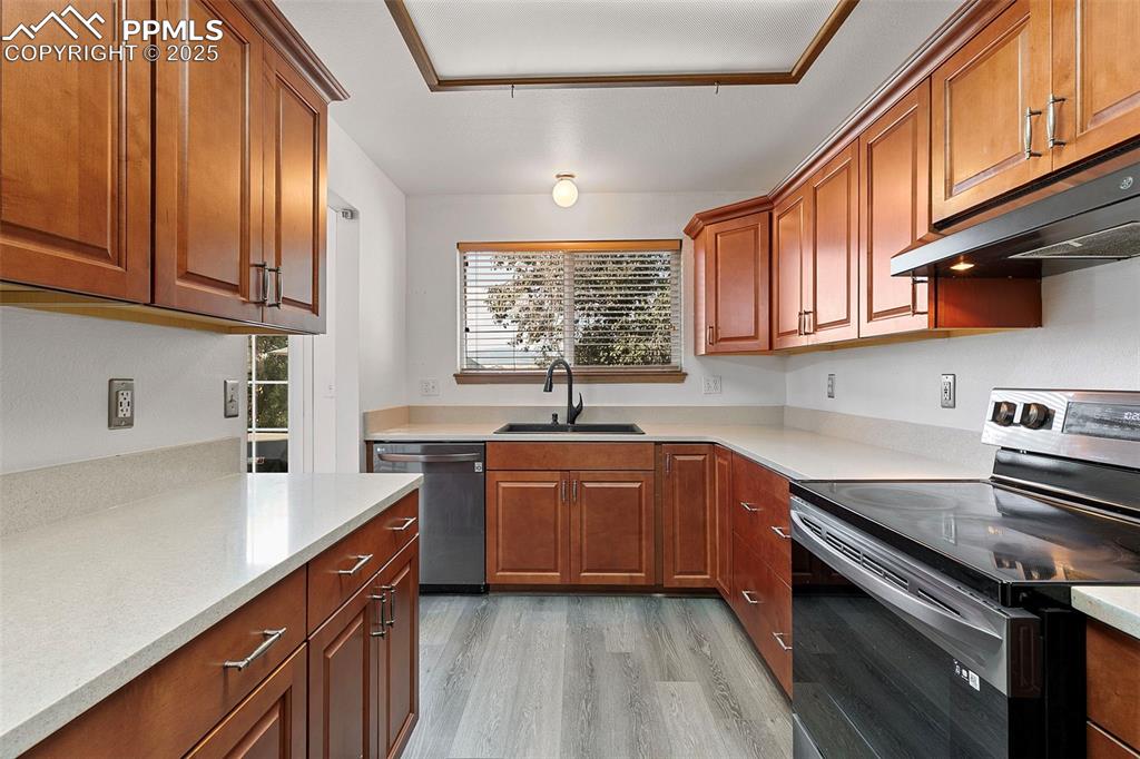 Image 8 of 29: Updated kitchen featuring black stainless appliances