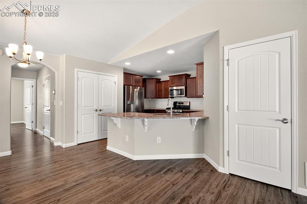 Image 11 of 39: Kitchen and dining area
