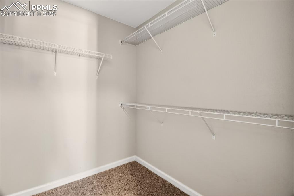Image 15 of 39: Walk in closet