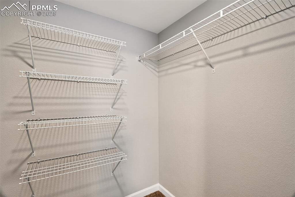 Image 31 of 39: Walk in closet