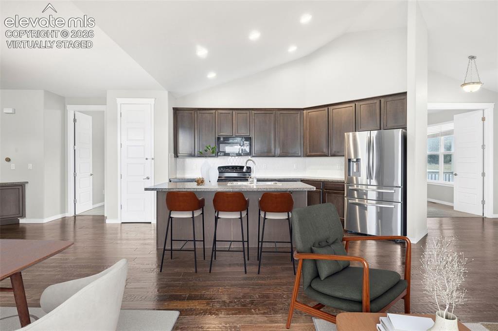 Image 15 of 39: Built-in workspace featuring a functional desk with lower cabinetry for con