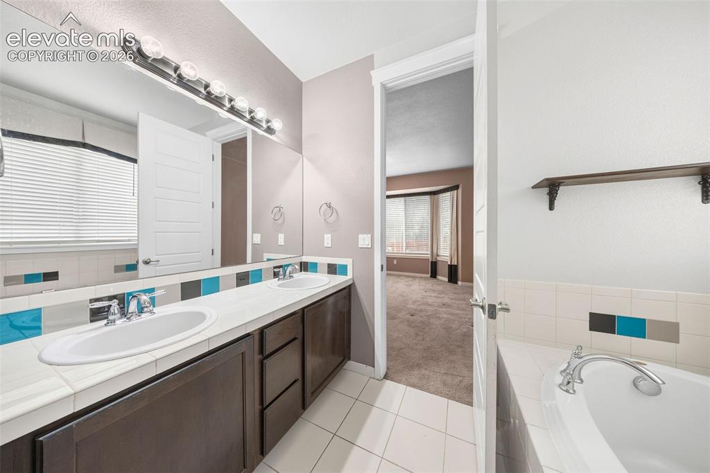 Image 25 of 39: Versatile secondary bedroom conveniently located off the front entryway, of