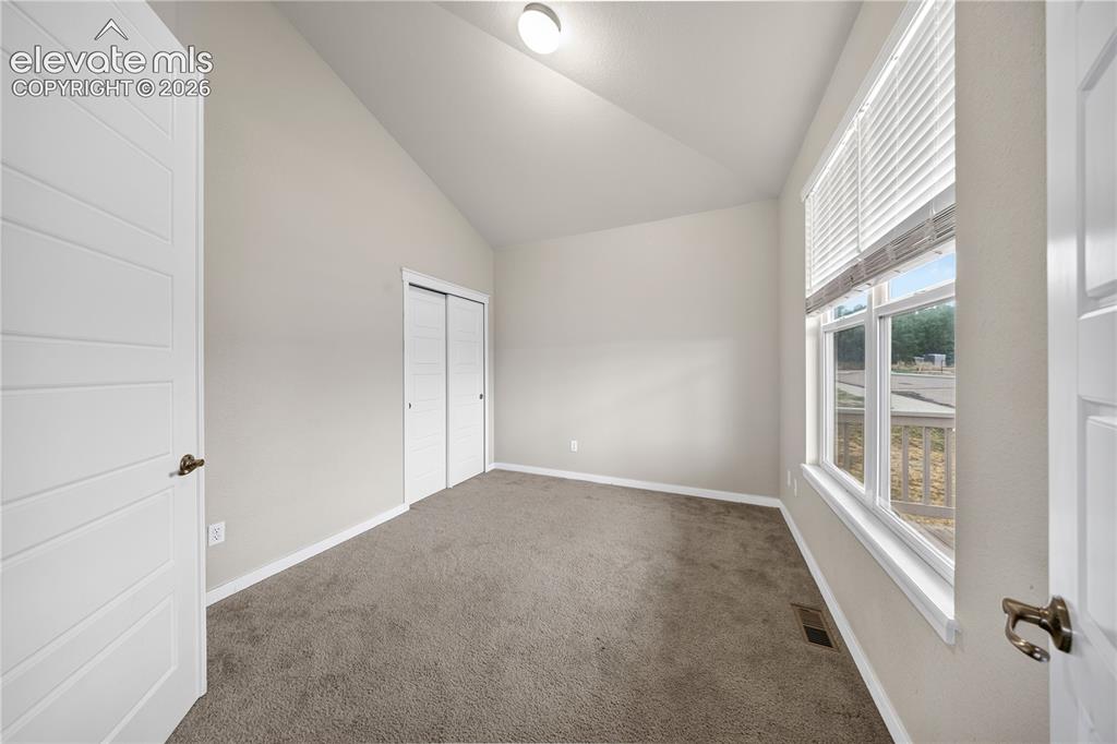 Image 29 of 39: Back entry with direct access to the private backyard and outdoor living sp