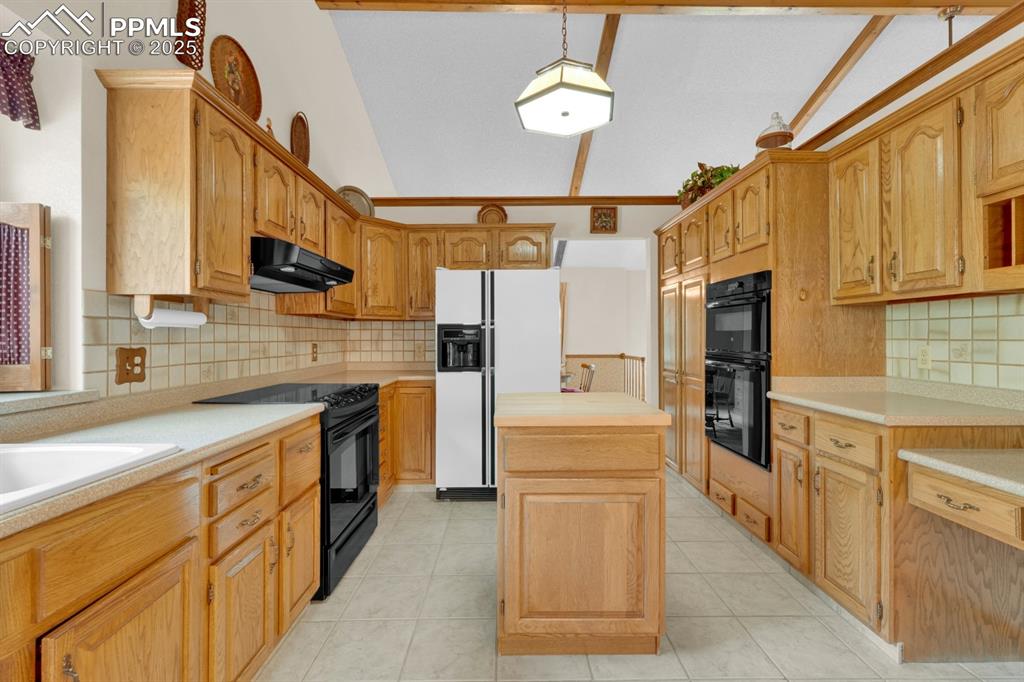 Image 11 of 47: Roomy kitchen with butcher block island 