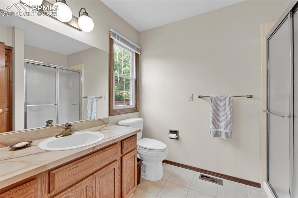 Image 24 of 47: Bathroom with tile flooring