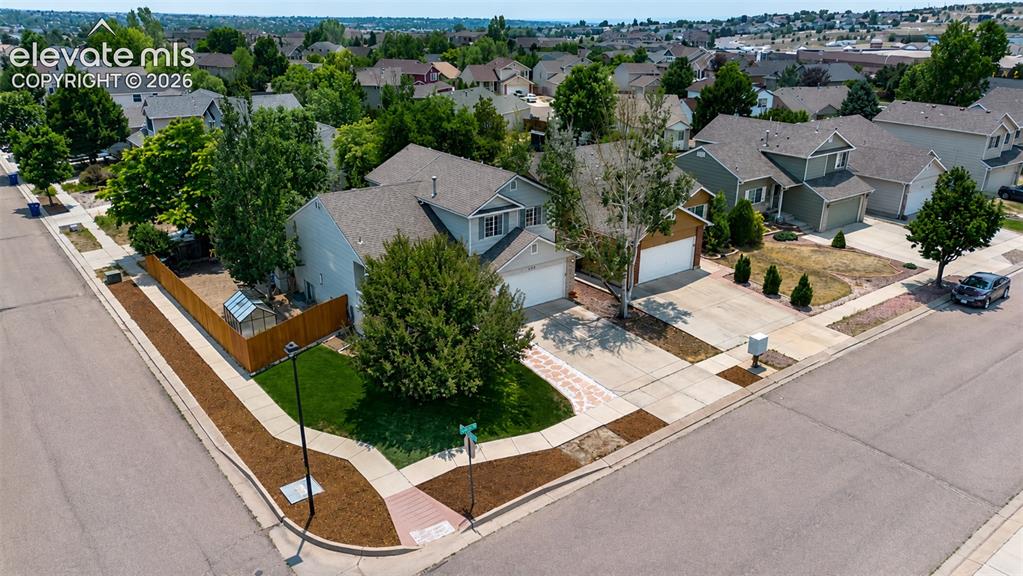 Image 45 of 49: Aerial view of corner lot