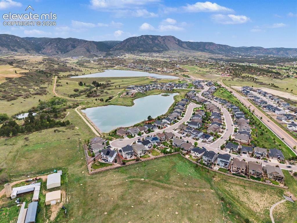 Image 10 of 44: Residential development featuring two prominent lakes, winding streets, and
