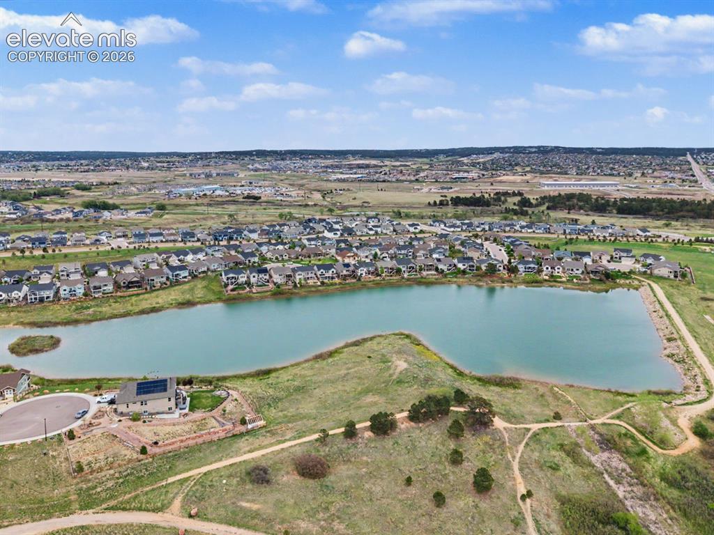 Image 13 of 44: Waterfront community featuring single-family residences, a natural lake, an