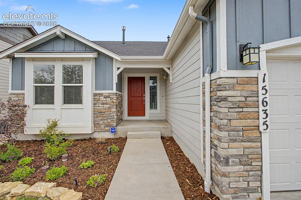 Image 17 of 44: Curb appeal featuring a multi-textured facade with horizontal siding, verti