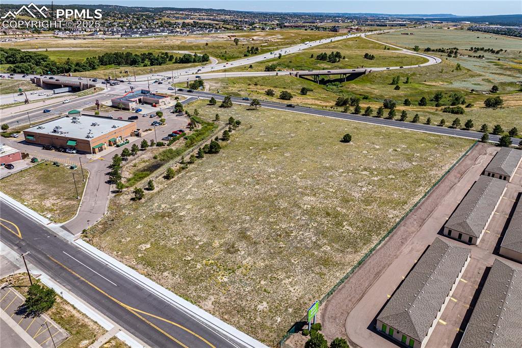 Image 11 of 13: Looking to the south across Lot A onto the intersection of I-25 and Second 