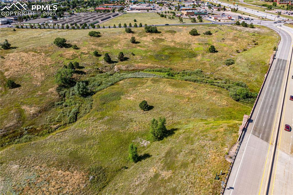 Image 7 of 13: Dirty Woman Creek along the bottom of the photo with both lots rising above