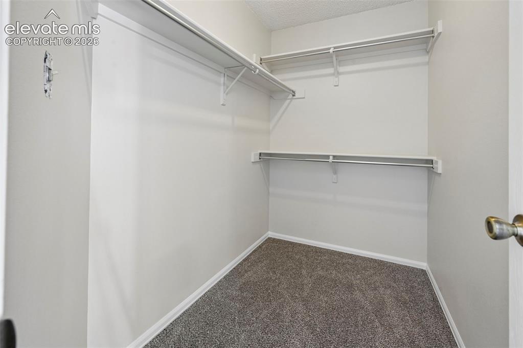 Image 13 of 18: Primary Closet 