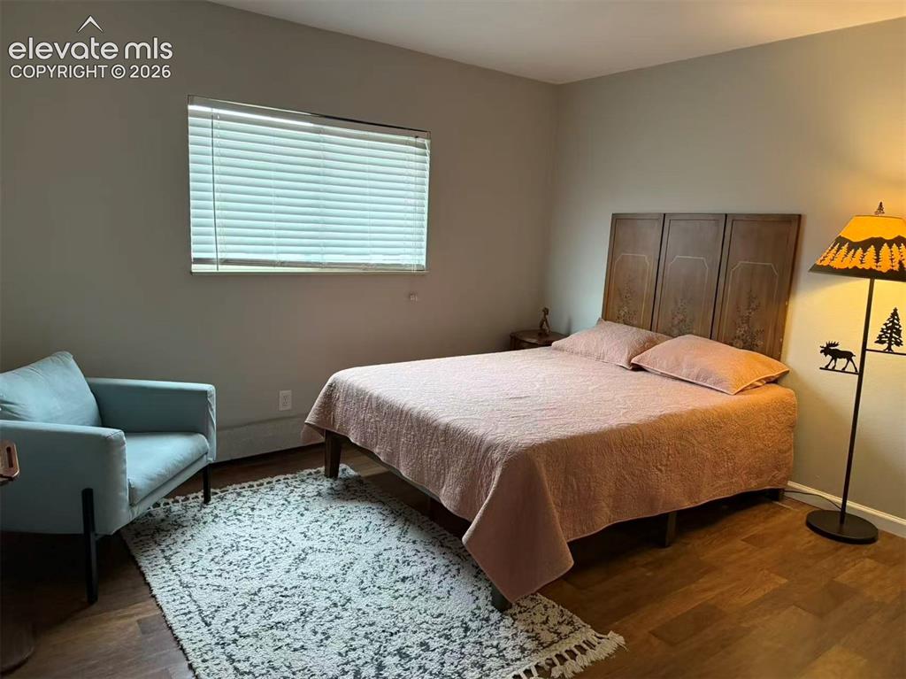 Image 5 of 11: Wood-finish flooring throughout