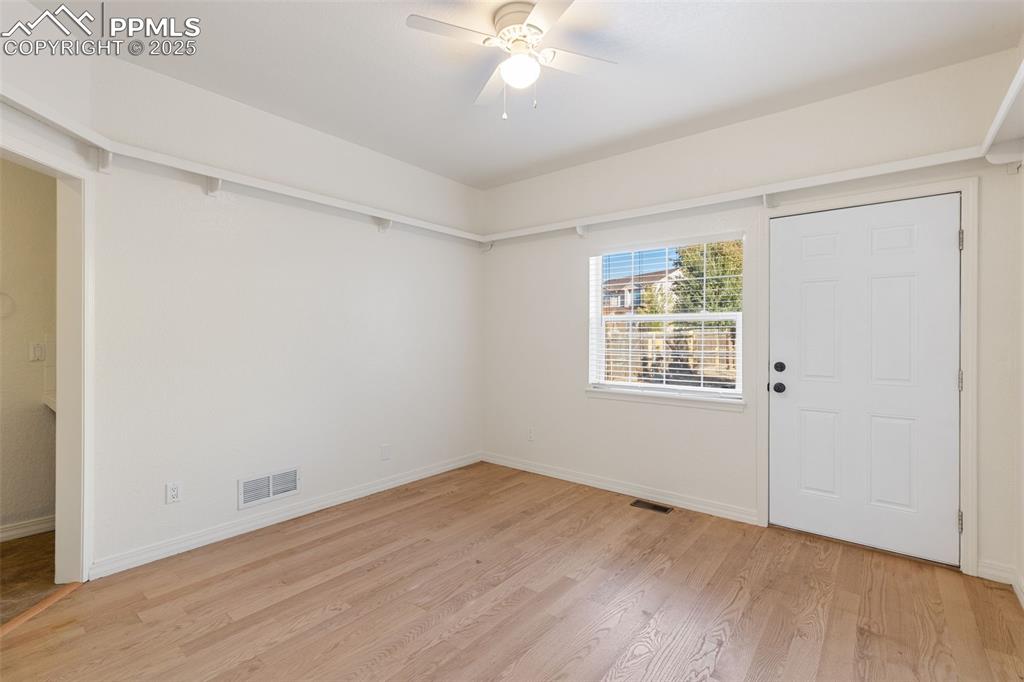 Image 29 of 50: Main level BR Walk out to yard