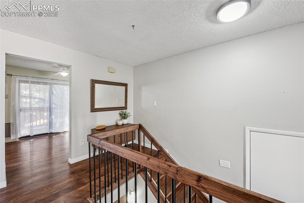 Image 11 of 44: Top of stairs upon entry looking into dining area