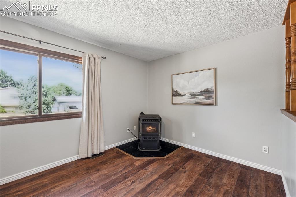 Image 12 of 44: Living room pellet stove